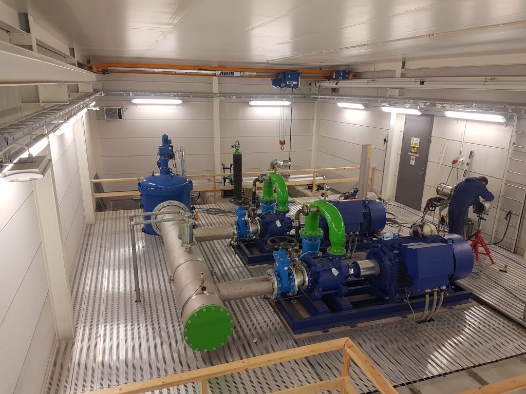 Blue industrial pump for process piping system
