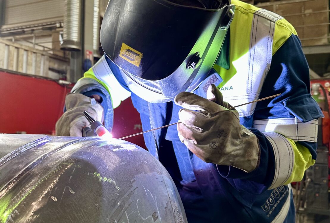 Mechanical Contractor — welder fabricating a pressure vessel in workshop.