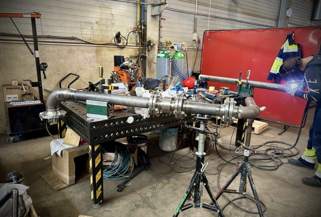 Prepared pipe section ready for welding in a pipe fabrication workshop. Cleaned edges and precise alignment ensure high-quality welds.