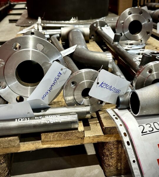 A pallet with prefabricated pipe components ready for welding and assembly in the pipe fabrication process. The prepared sections ensure efficient production and installation.